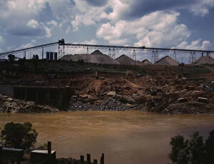 Building Materials Gallery: Above the construction work, the aggregate storage pile which... Fort Loudoun Dam, Tenn. 1942