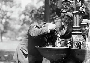 Caps Prints: Cooling his head - N.Y. on hot day, between c1910 and c1915. Creator: Bain News Service