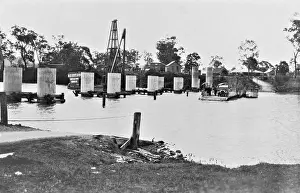 1929 Prints: Coomera River Ferry and construction of the road bridge, 1929. Creator: Jack Bain