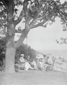 Cosgrave Prints: Cosgrave group seated outdoors, 1917 Creator: Arnold Genthe