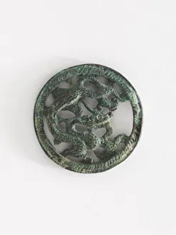 Costume ornament: dragon in roundel (pair with F1917.566), Goryeo period Costume ornament: dragon in roundel (pair with F1917.566), Goryeo period