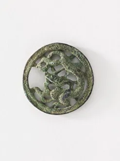 Costume ornament: dragon in roundel (pair with F1917. 565), Goryeo period