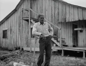 Southerner Prints: Cotton worker in Sunday clothes, near Blytheville, Arkansas, 1937. Creator: Dorothea Lange