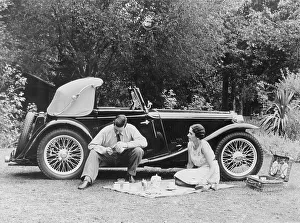 Picnic Prints: Couple having a picnic by an MG TA Midget, late 1930s