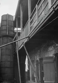 Cistern Prints: Courtyard with cistern, New Orleans, between 1920 and 1926. Creator: Arnold Genthe