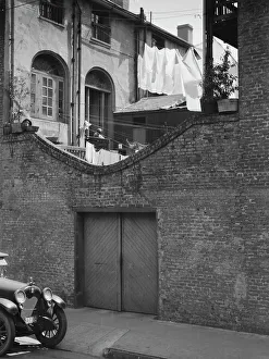 Garage Prints: Courtyard with a garage, New Orleans, between 1920 and 1926. Creator: Arnold Genthe