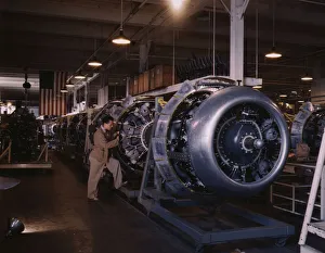 War Production Gallery: Cowling and control rods are added to motors for...North American Inc. Inglewood, Calif. 1942