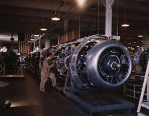 Airplane Industry Gallery: Cowling and control rods are added to motors for...North American Inc. Inglewood, Calif. 1942