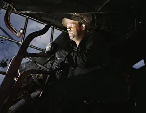 Palmer Alfred T Prints: Crane operator at TVAs Douglas Dam, Tennessee, 1942. Creator: Alfred T Palmer