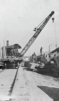 Hoisting Machinery Prints: Crane being used in construction of new railway bridge