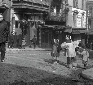 Lanterns Prints: The crossing, Chinatown, San Francisco, between 1896 and 1906. Creator: Arnold Genthe