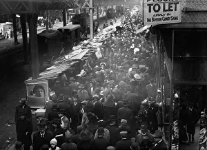 Congested Prints: Crowded street, possibly near a subway station