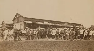 Expatriate Prints: Crowds of people in front of buildings at the marketplace in the center of town