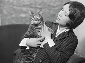 Cumner, Gwendolyn, Miss, with cat (possibly Pudge), portrait photograph, 1928 Creator: Arnold Genthe