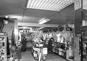 Retail Gallery: Customers in the Barnsley Co-ops sports department, South Yorkshire, 1957. Artist