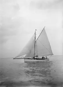 The Solent Prints: The cutter Blue Bird under sail, 1934. Creator: Kirk & Sons of Cowes