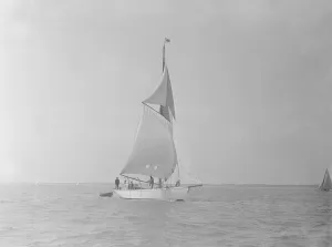 Under Sail Prints: The cutter Mavourneen running downwind, 1922. Creator: Kirk & Sons of Cowes