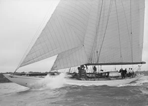 The cutter Minstrel competing in the round Island Race, 1938. Creator: Kirk & Sons of Cowes