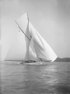 The cutter Rosamond sailing with spinnaker, 1911. Creator: Kirk & Sons of Cowes The cutter Rosamond sailing with spinnaker, 1911. Creator: Kirk & Sons of Cowes