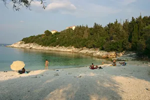 Sunbathing Prints: Dafnoudi Beach near Fiscardo, Kefalonia, Greece