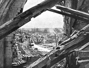Dans Montdidier libere; un quartier de Montdidier vu par une breche de l'eglise, apres... 1918. Creator: Unknown