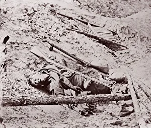 Brady Prints: Dead Confederate Soldier at Fort Mahone, Petersburg, 1864. Creator: Unknown