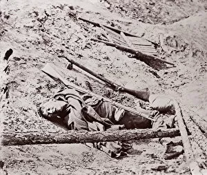 Brady Collection: Dead Confederate Soldier at Fort Mahone, Petersburg, 1864. Creator: Unknown