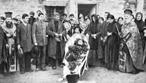 Bereavement Gallery: A dead Greek peasant lying in a coffin, 1922.Artist: HA Fawcett