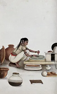 Crouching Prints: Delhi: a woman grinding grain into flour, (between 1800 and 1899?). Creator: Unknown