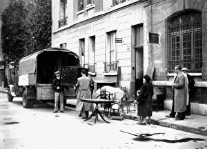 Occupied Prints: Delivery of furniture confiscated from Jews to victims of RAF bombing, Paris, April 1942