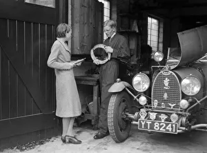 Motor Maintenance Gallery: Denis Evans working on his Bugatti Type 43 2262cc. Artist: Bill Brunell