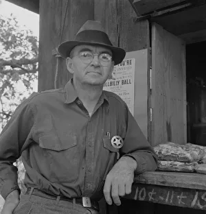Employer Gallery: Deputy sheriff, stationed at paymasters window... near Grants Pass, Josephine County, Oregon