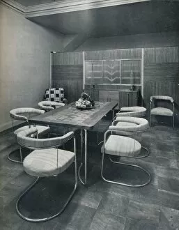 A dining-room suite, with table and chairs of steel tube. By Practical Equipment Ltd. of London