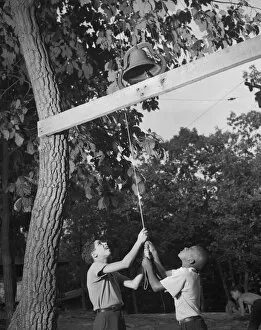 Holiday Gallery: Dinner bell, Camp Nathan Hale, Southfields, New York, 1943 Creator: Gordon Parks