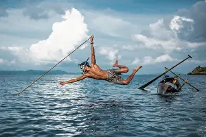 Traditional Culture Prints: Disappearing fishing method by Moken. Creator: Dorte Verner