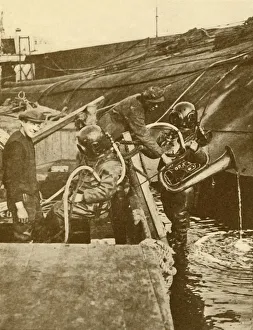Salvage Prints: A Diver With Euphonium and Swords from the German Kaiser Scuttled at Scapa, c1930