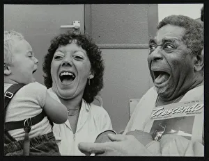 Amusing Gallery: Dizzy Gillespie meeting baby Gary Colfer at Knebworth, Hertfordshire, July 1982. Artist