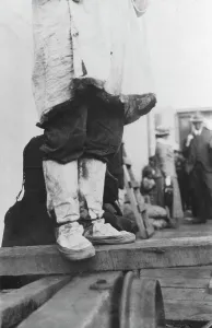 Nome Alaska United States Prints: On a dock in Nome, between c1900 and 1916. Creator: Unknown