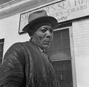 Wharf Gallery: Dock worker, Washington, D.C. 1942. Creator: Gordon Parks