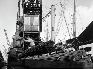 Dockers loading steel bars onto the Manchester Renown, Manchester, 1964. Artist