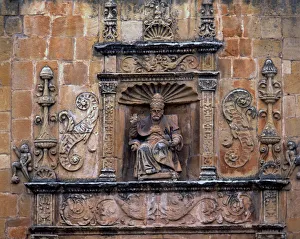 Crowned Prints: Front door of St. Peters Cathedral, crowned by the seated image of Saint Peter Pope