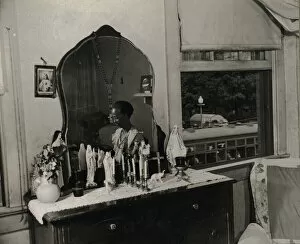 Film Negative Collection: Dresser in the bedroom of Mrs. Ella Watson, a government charwoman, Washington, D. C. 1942