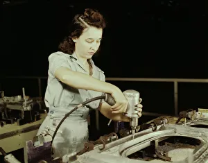 Aeronautics Gallery: Drilling a wing bulkhead for a transport plane at the Consolidated Air... Fort Worth, Texas, 1942