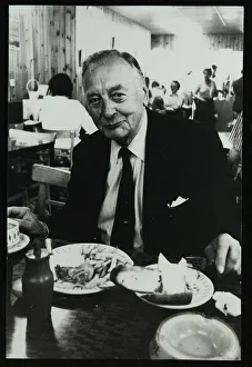 Drummer Max Abrams enjoying a plate of fish and chips in a Soho chip shop, London, 1983