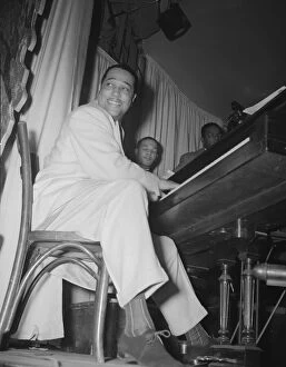 Piano Player Gallery: Duke Ellington, orchestra leader, New York, 1943. Creator: Gordon Parks