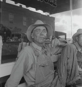 Dustbowl Prints: Dust bowl farmers of west Texas in town, 1937. Creator: Dorothea Lange