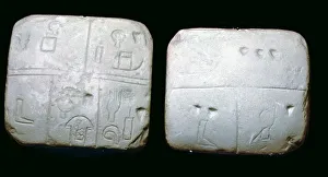 Early Sumerian stone tables, inscribed with very early archaic pictographic symbols