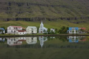Reflected Collection: East Fjord Town, Iceland. Creator: Tom Artin
