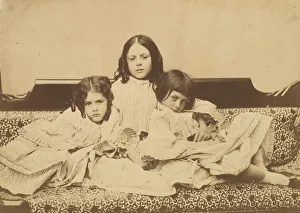 Carroll Lewis Collection: Edith, Ina and Alice Liddell on a Sofa, Summer 1858. Creator: Lewis Carroll