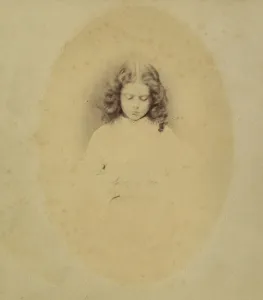 Edith Liddell Seated Beside a Vase of Foxgloves, 1860. Creator: Lewis Carroll